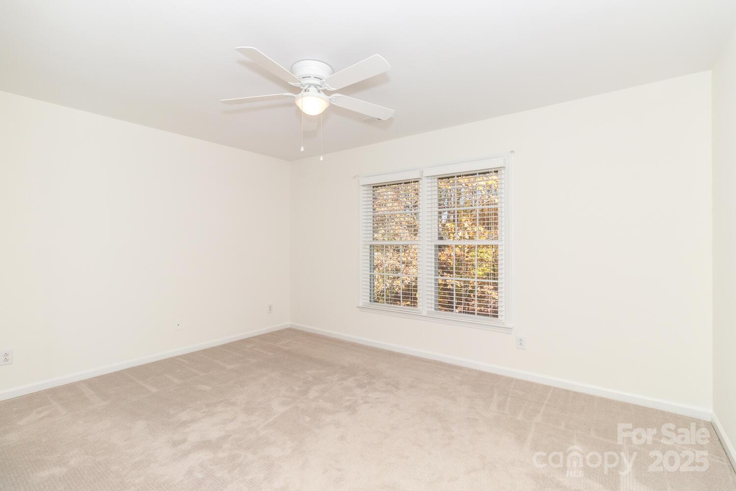 11025 Jordan Rae Lane Charlotte, NC 28277 - Photo 19 of 33 an empty room with windows and fan