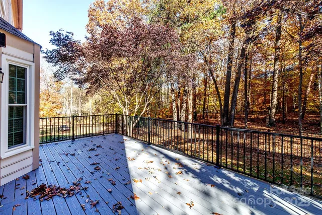 a view of a balcony with wooden floor