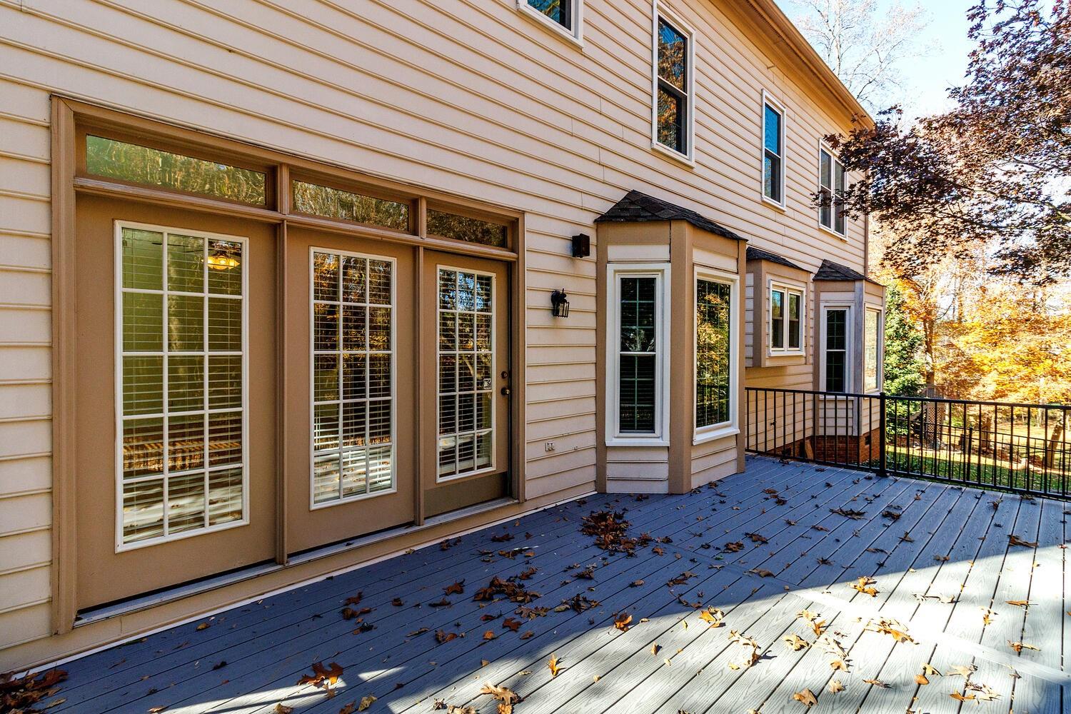 11025 Jordan Rae Lane Charlotte, NC 28277 - Photo 26 of 33 a view of a house with a large window and wooden fence