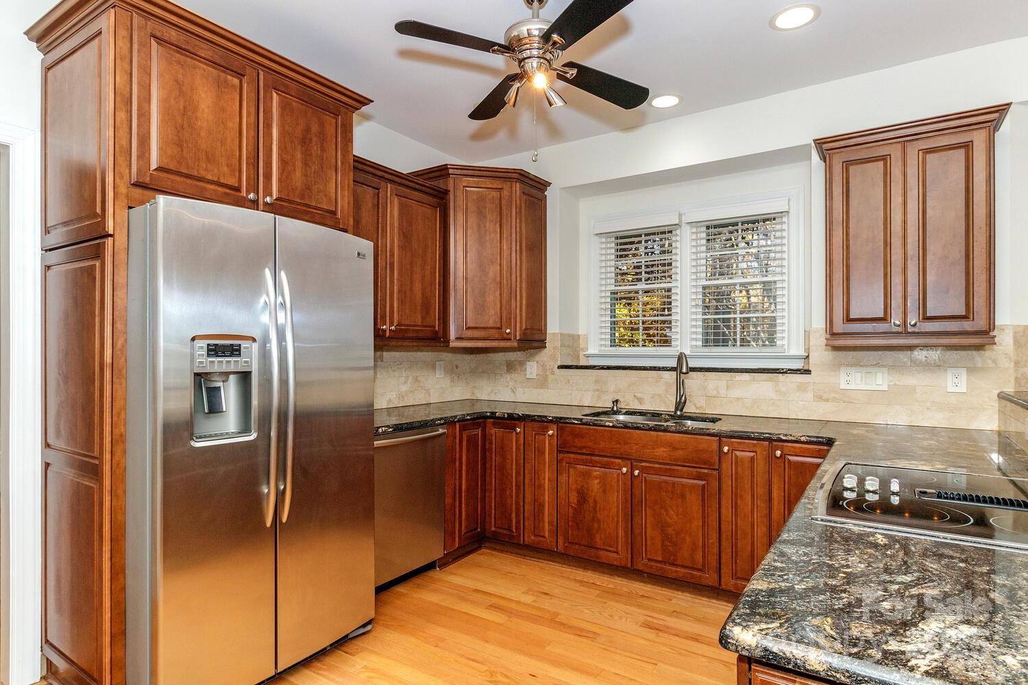 11025 Jordan Rae Lane Charlotte, NC 28277 - Photo 7 of 33 a kitchen with stainless steel appliances granite countertop a refrigerator a sink and dishwasher