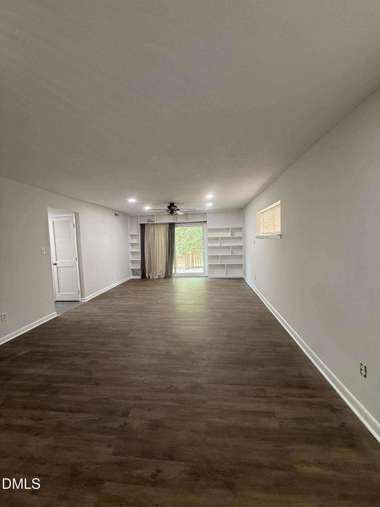 546 Pine Ridge Place Raleigh, NC 27609 - Photo 6 of 28 a view of empty room with wooden floor