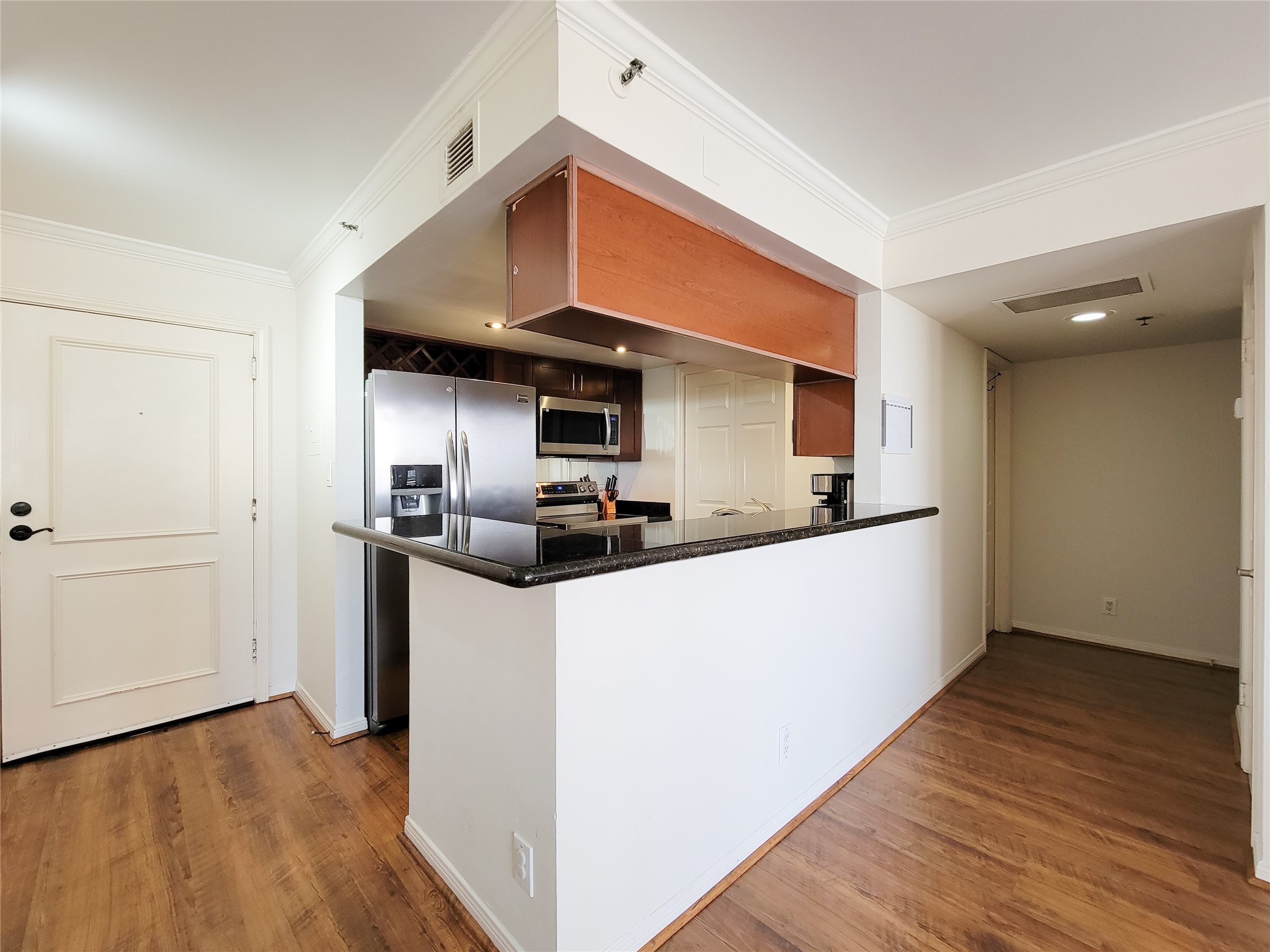 3525 Sage Road, Unit 1605 Houston, TX 77056 - Photo 6 of 33 a view of kitchen with sink and wooden floor