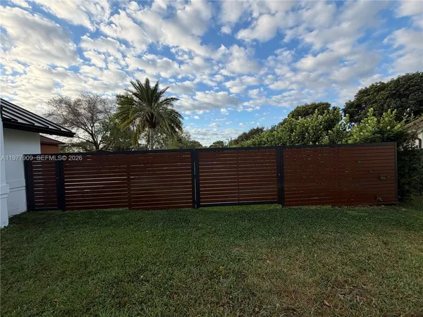 a living room with furniture and large window