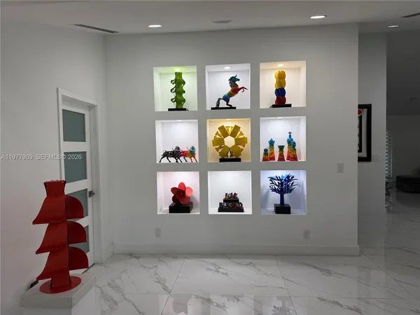 a view of a dining room with furniture and a livingroom