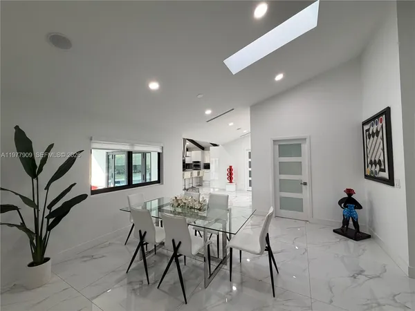 a view of a house with a backyard