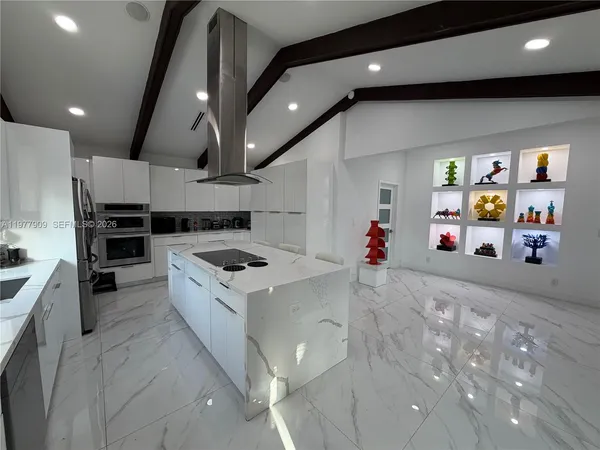 a view of pool and trees in the background