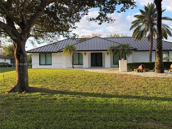 a backyard of a house with lots of green space