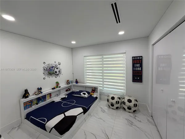 a view of a house with yard and sitting area