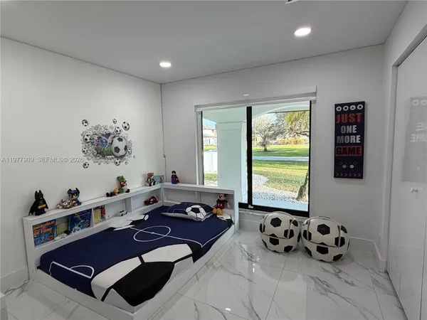 a view of a swimming pool with a patio and a garden