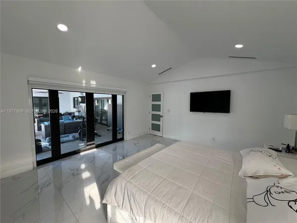 swimming pool view with a seating space