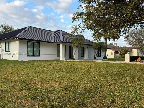 a view of a balcony with an outdoor space and barbeque oven