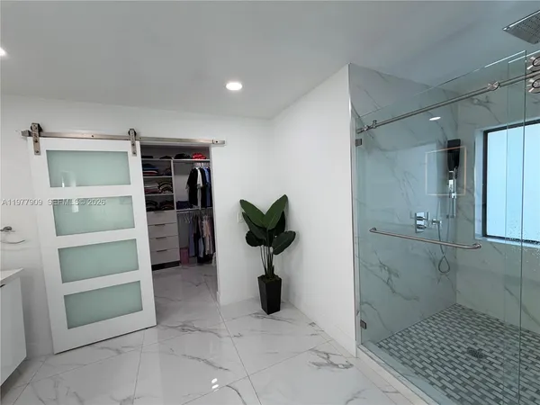 a living room with furniture a rug and a chandelier