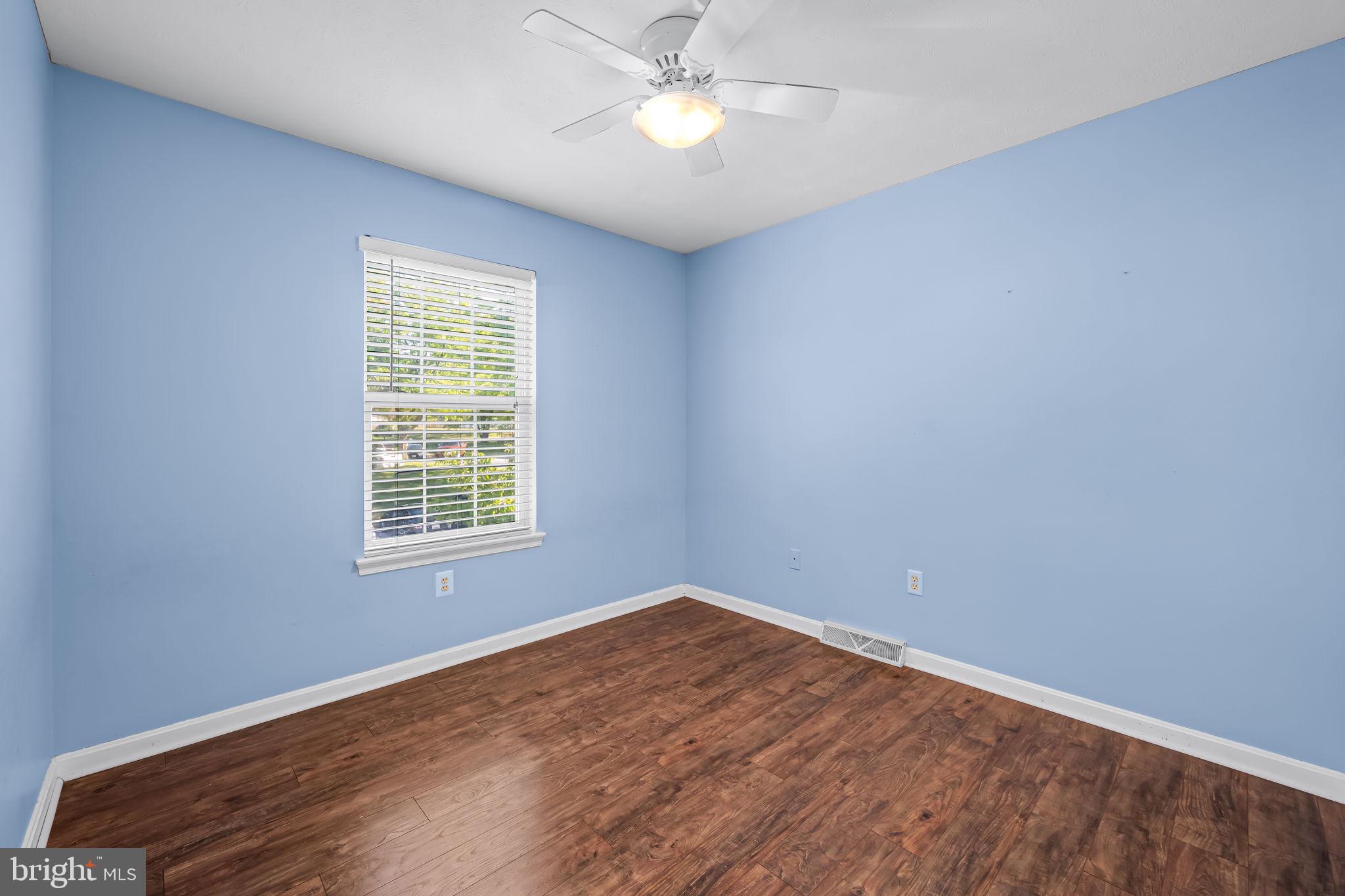 4630 Marksman Court Hampstead, MD 21074 - Photo 11 of 16 an empty room with a window and a fan