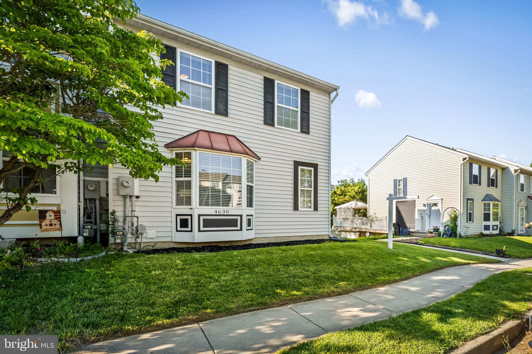 4630 Marksman Court Hampstead, MD 21074 - Photo 2 of 16 a front view of a house with a yard