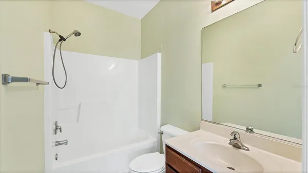 a bathroom with a sink a toilet and a bathtub