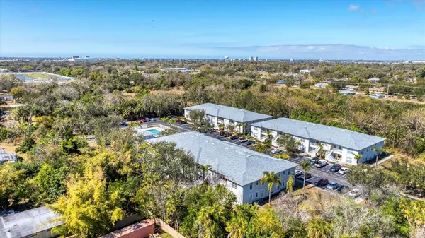 an aerial view of a house with a city view