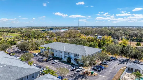 an aerial view of a house with a yard