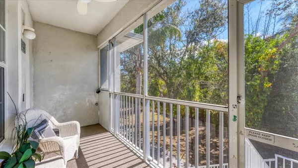 a view of a balcony with chair