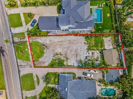 an aerial view of a house with outdoor space