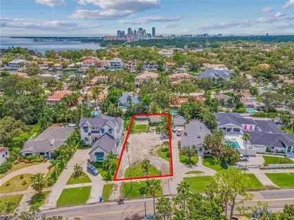 an aerial view of residential building and lake