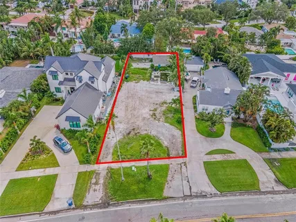 an aerial view of multiple houses with yard