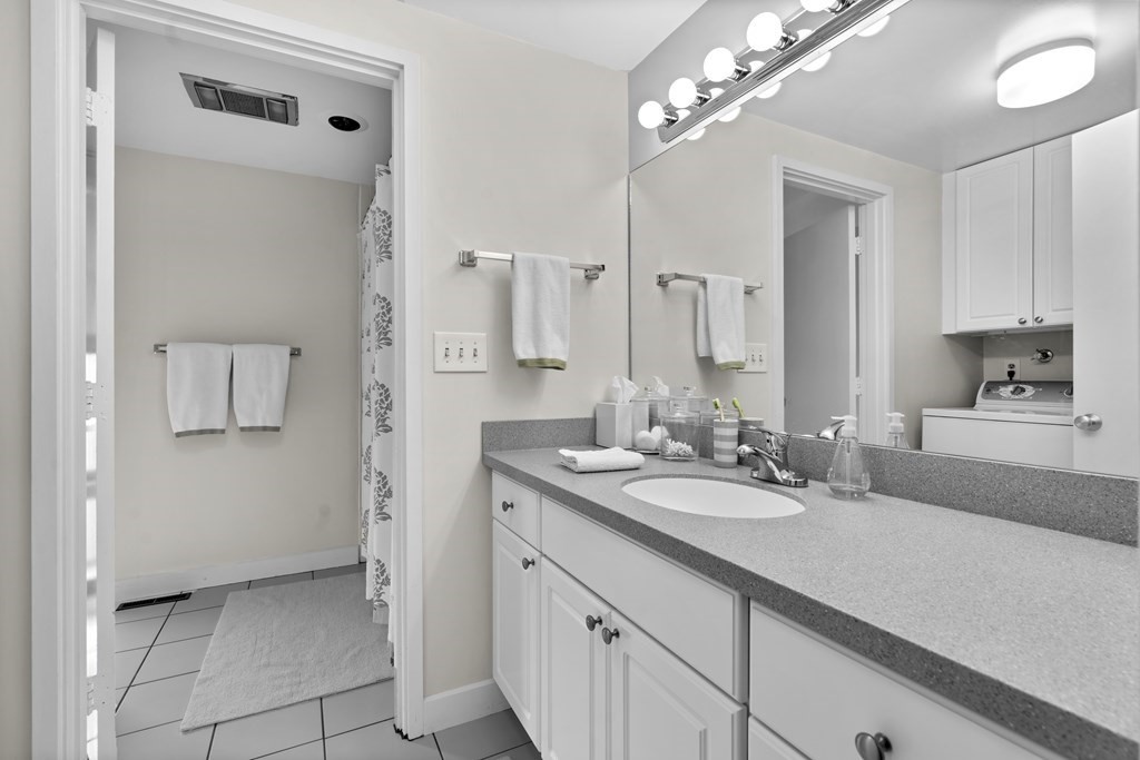 11 Oak Street, Unit 35 Wellesley, MA 02482 - Photo 13 of 22 a bathroom with a sink and a mirror