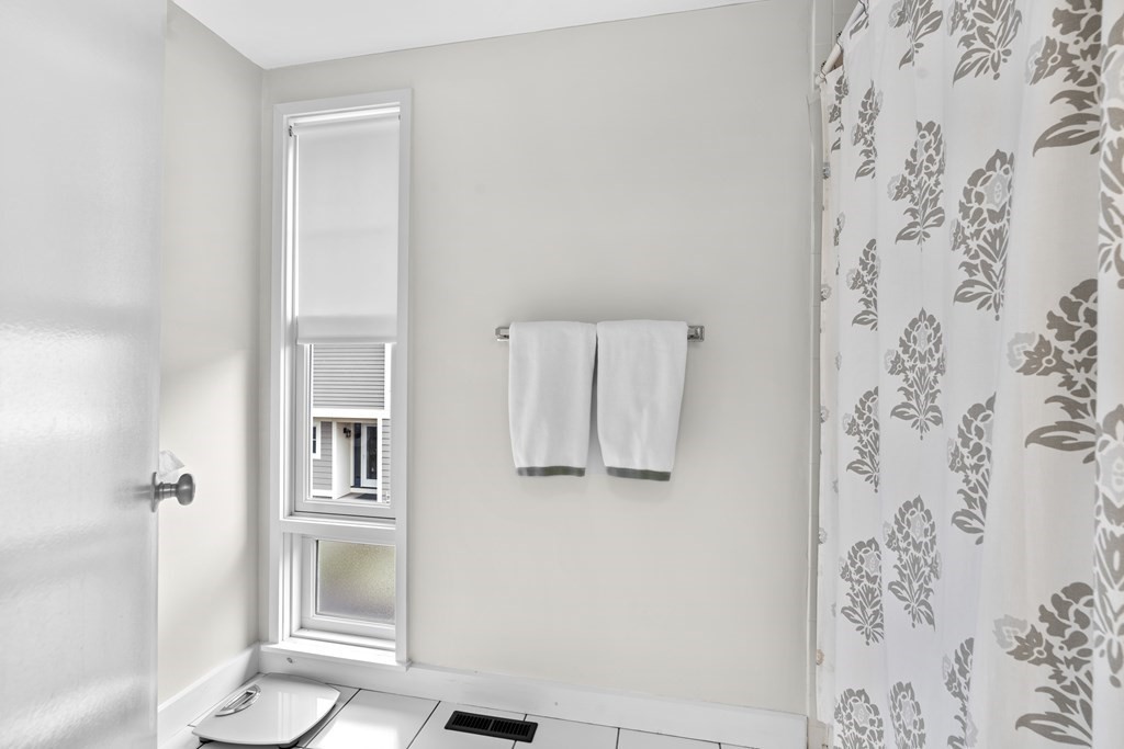 11 Oak Street, Unit 35 Wellesley, MA 02482 - Photo 14 of 22 a bathroom with a shower and a toilet