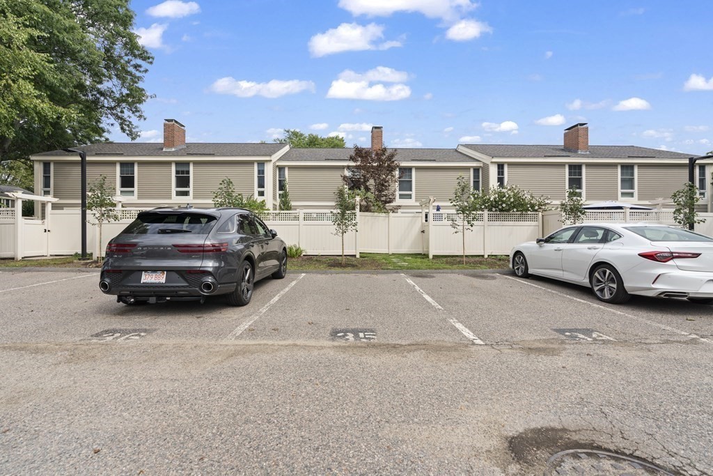 11 Oak Street, Unit 35 Wellesley, MA 02482 - Photo 22 of 22 a car parked in front of a house