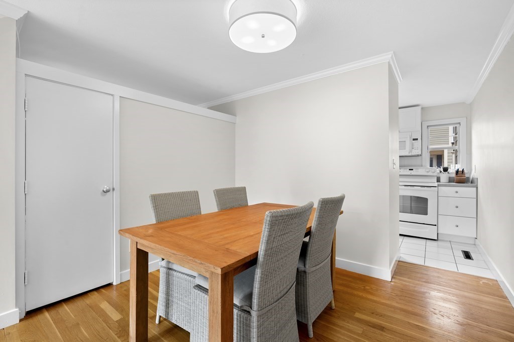 11 Oak Street, Unit 35 Wellesley, MA 02482 - Photo 3 of 22 a view of a dining room with furniture