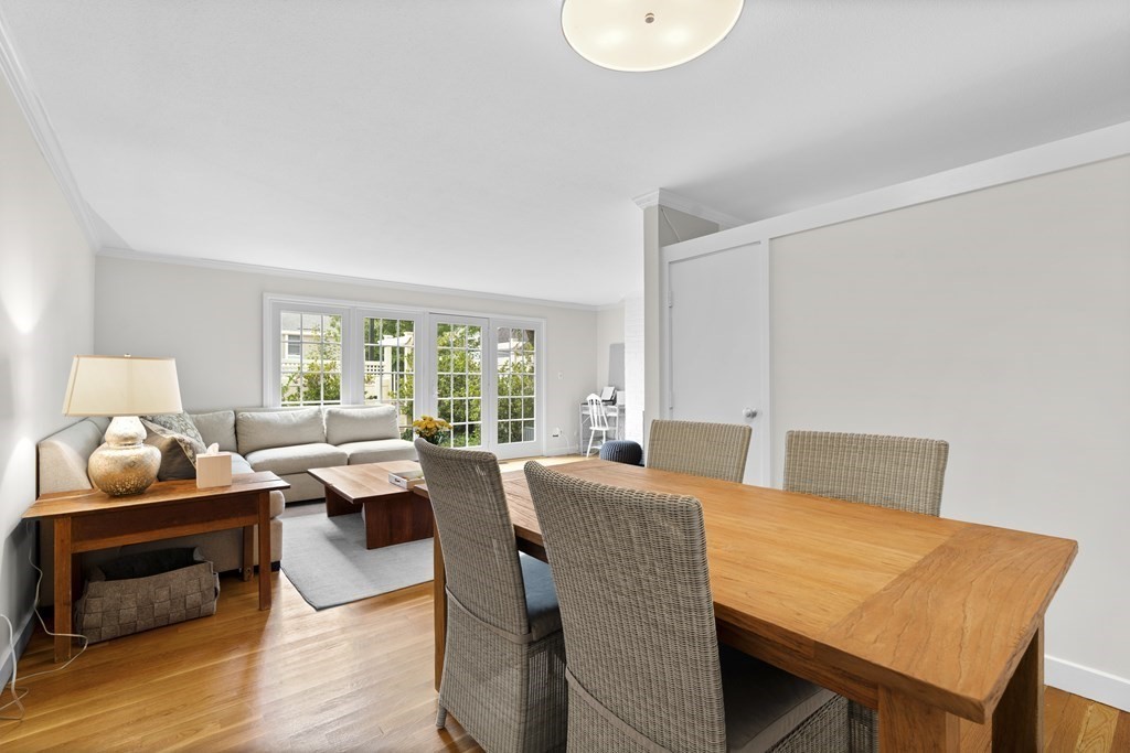 11 Oak Street, Unit 35 Wellesley, MA 02482 - Photo 4 of 22 a view of a dining room with furniture window and wooden floor