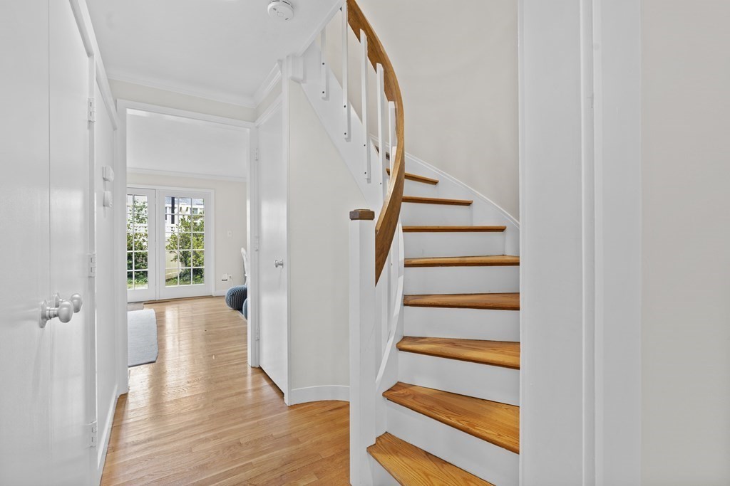 11 Oak Street, Unit 35 Wellesley, MA 02482 - Photo 9 of 22 a view of a hallway with wooden floor and entryway