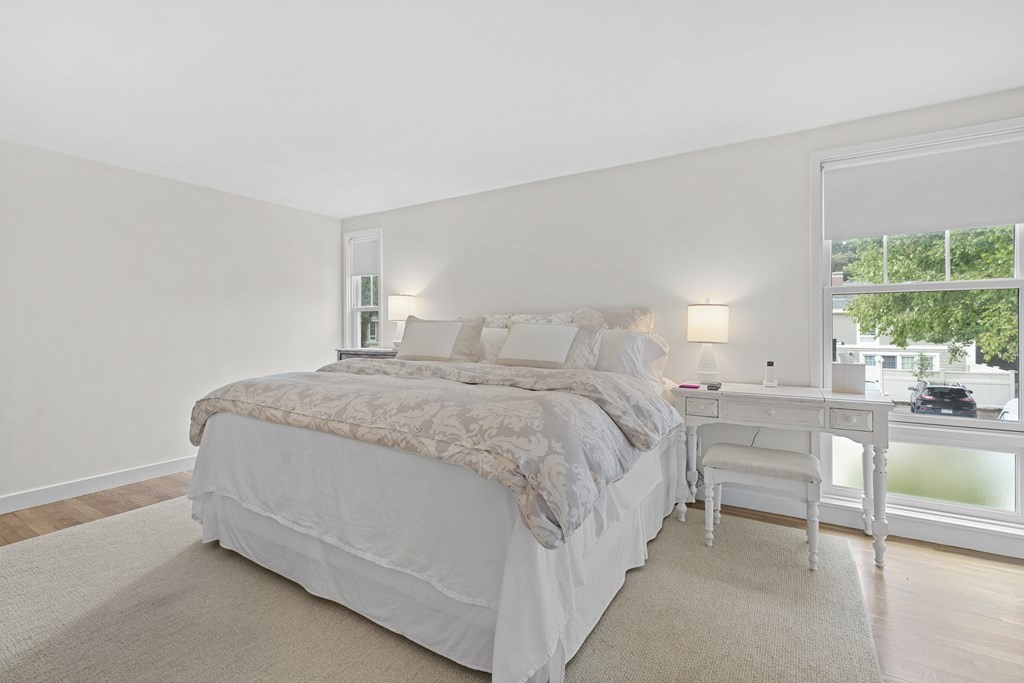 11 Oak Street, Unit 35 Wellesley, MA 02482 - Photo 10 of 22 a spacious bedroom with a bed and a large window