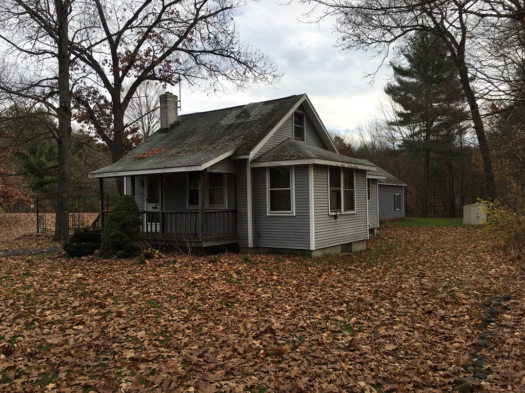 185 Shirley Road Lancaster, MA 01523 - Photo 2 of 15 a front view of a house with a garden