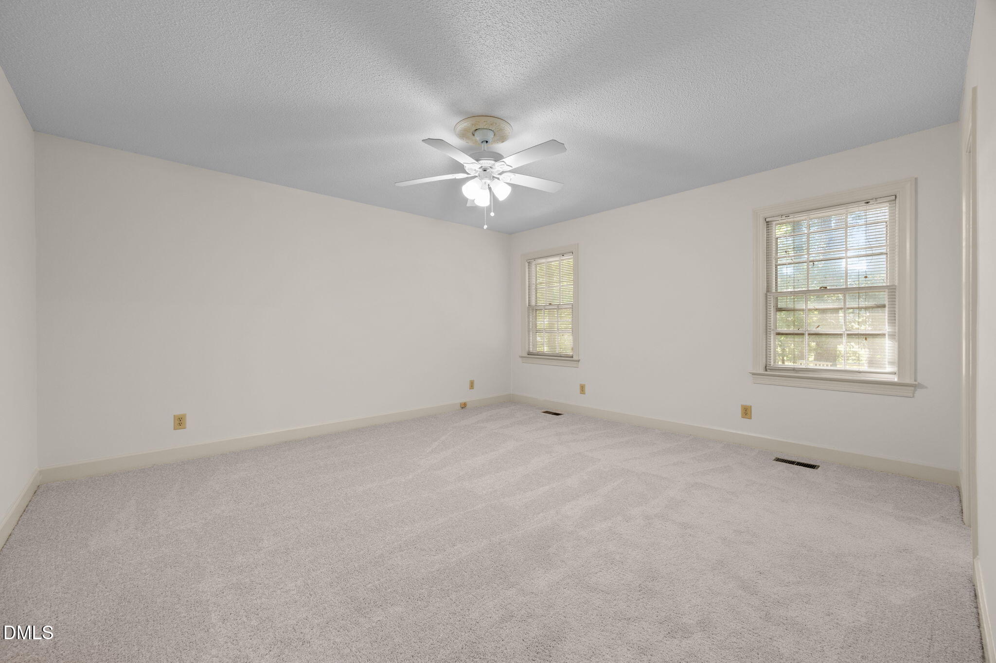 8701 Oneal Road Raleigh, NC 27613 - Photo 15 of 33 an empty room with a window and a fan