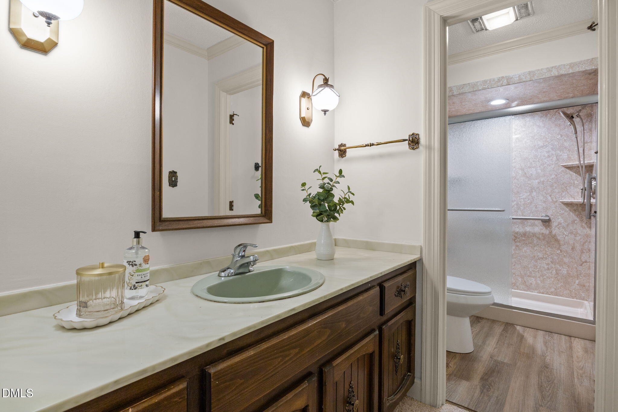 8701 Oneal Road Raleigh, NC 27613 - Photo 17 of 33 a bathroom with a granite countertop sink a toilet and shower