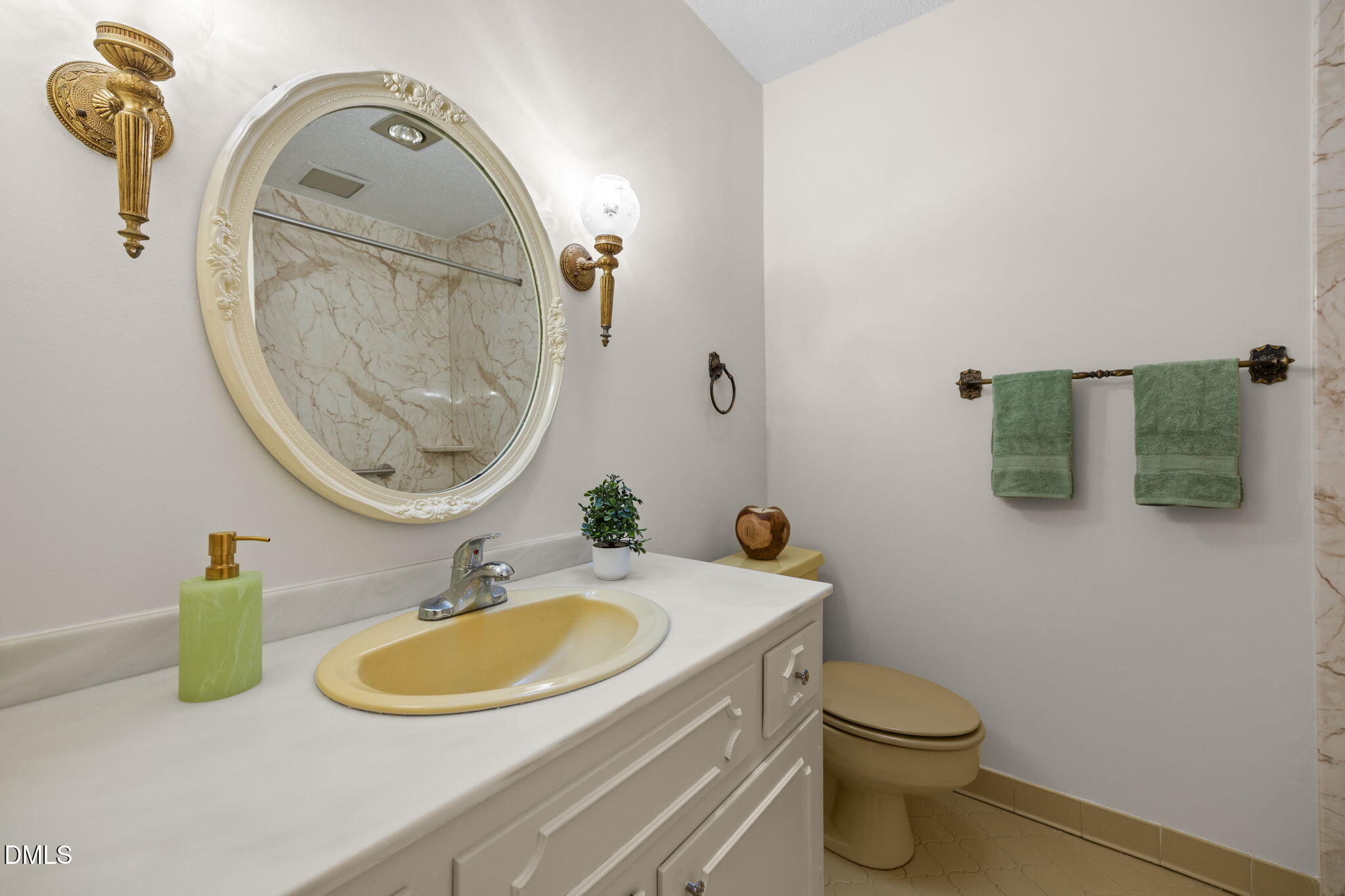 8701 Oneal Road Raleigh, NC 27613 - Photo 20 of 33 a bathroom with a sink and a mirror
