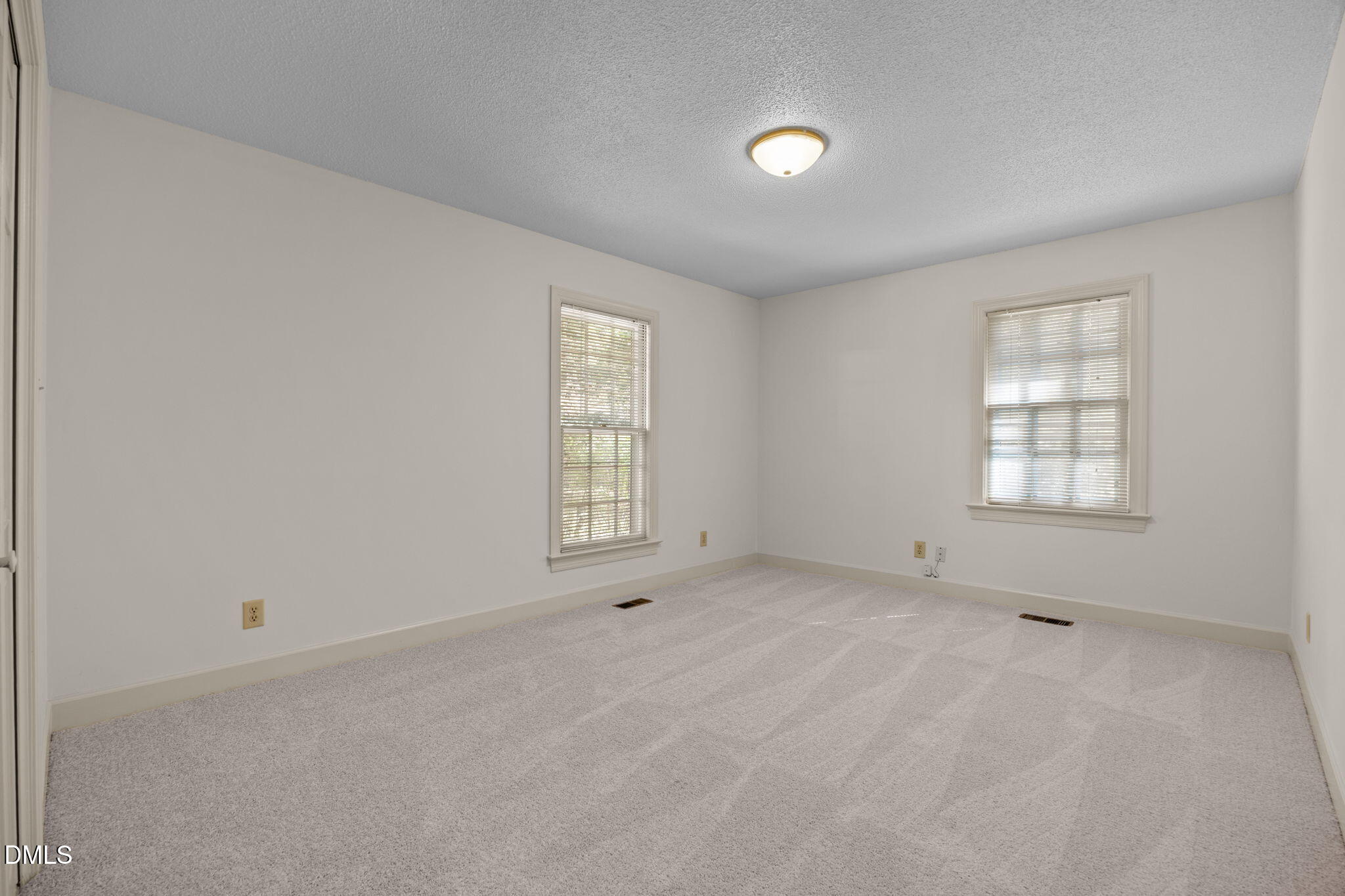 8701 Oneal Road Raleigh, NC 27613 - Photo 22 of 33 an empty room with windows