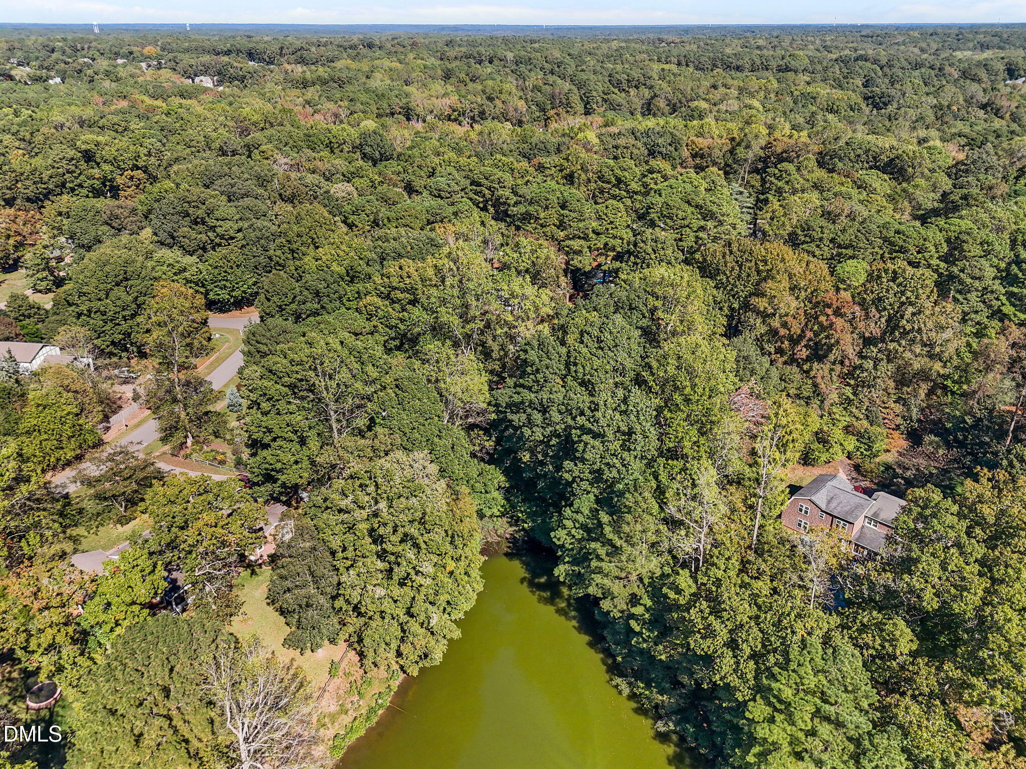 8701 Oneal Road Raleigh, NC 27613 - Photo 27 of 33 an aerial view of residential houses with outdoor space and trees