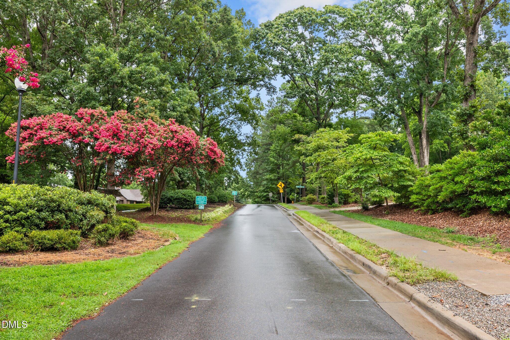 8701 Oneal Road Raleigh, NC 27613 - Photo 31 of 33 a view of a garden with flowers and a pathway