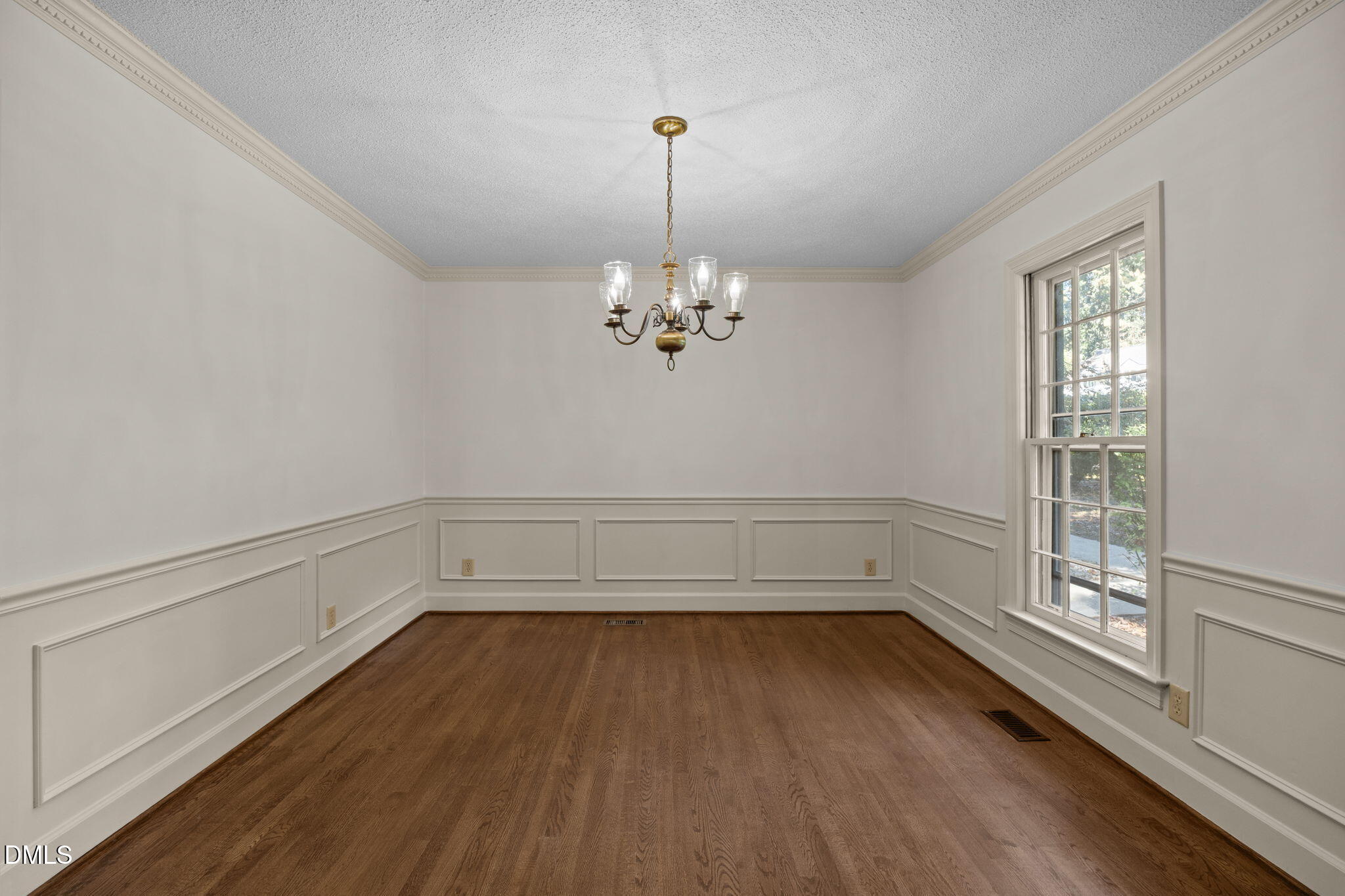 8701 Oneal Road Raleigh, NC 27613 - Photo 6 of 33 a view of a room with wooden floor and white walls