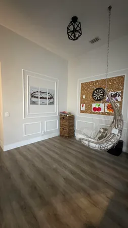 a view of a livingroom with wooden floor