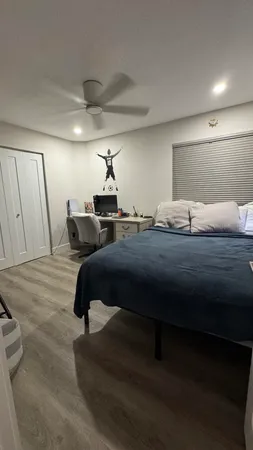 a bed room with a bed and a couch