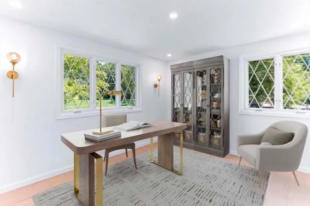 a workspace with furniture and a window