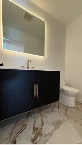 a bathroom with a sink and a toilet