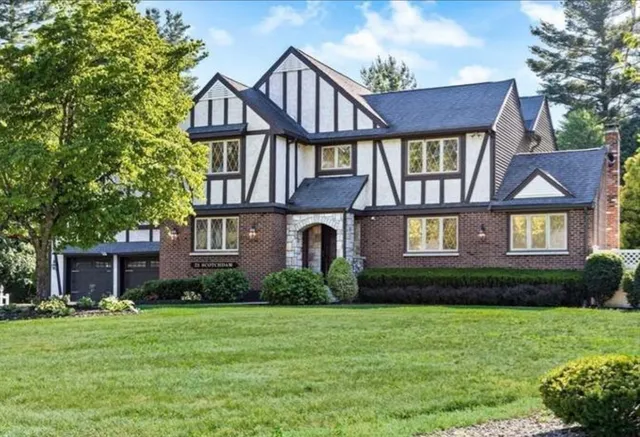 a front view of a house with garden