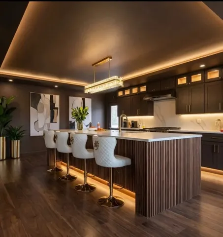 a living room with furniture and kitchen view