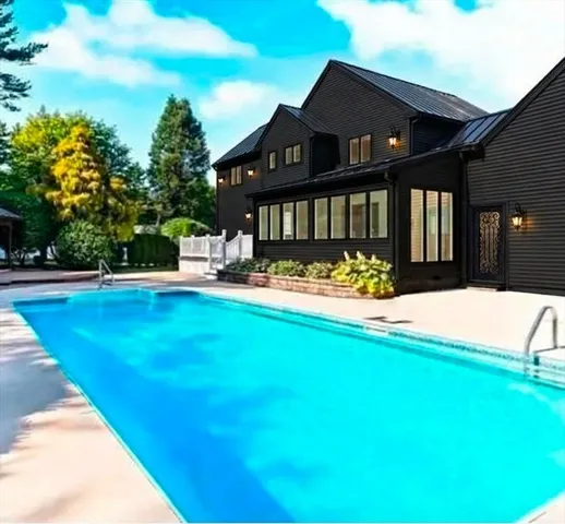 a view of a house with swimming pool