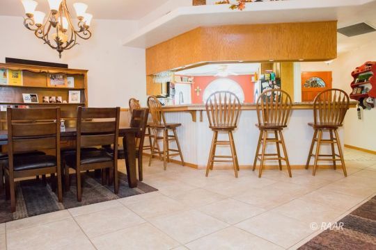 412 Mavis Court Ridgecrest, CA 93555 - Photo 10 of 35 a view of a dining room with furniture and a kitchen view