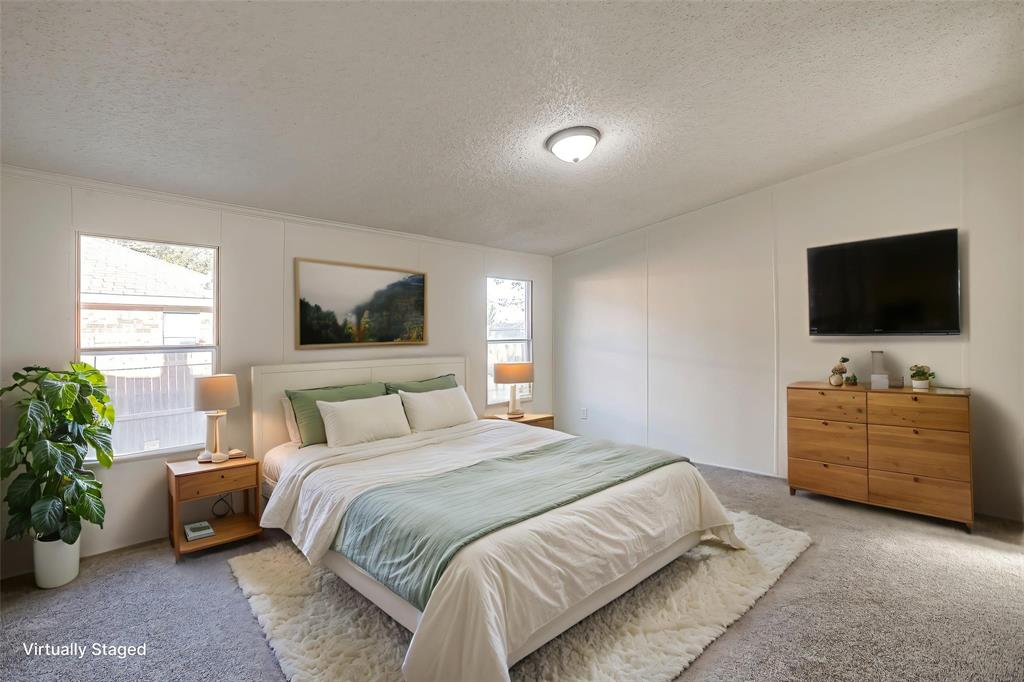 317 6th Street Joshua, TX 76058 - Photo 16 of 36 a bedroom with a bed and a flat screen tv