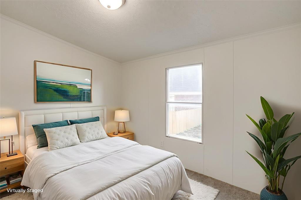 317 6th Street Joshua, TX 76058 - Photo 25 of 36 a bedroom with bed and a flat screen tv